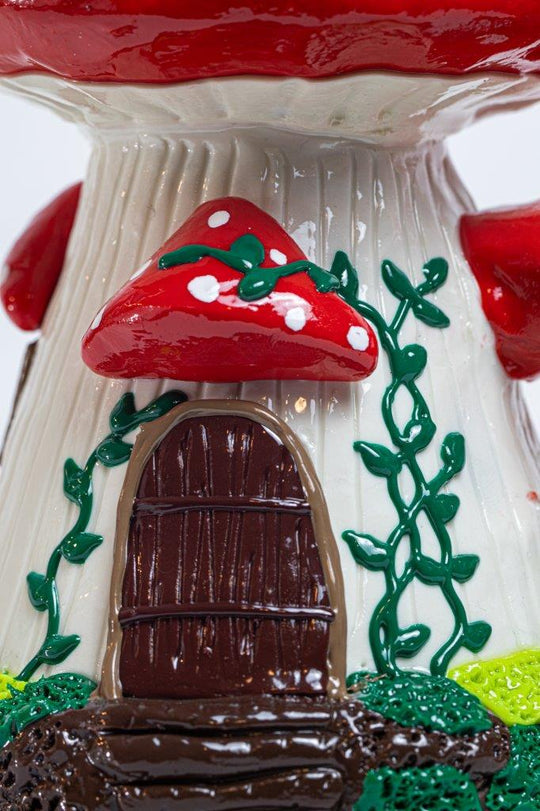 7.5-inch Mushroom Water Pipe – a bong with a Mushroom House design for weed and dabs. For sale now, this unique piece features a 14MM male bowl piece for weed and a bent down stem, turning every hit into a magical and flav