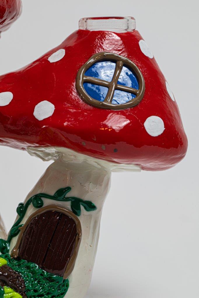 7.5-inch Mushroom Water Pipe – a bong with a Mushroom House design for weed and dabs. For sale now, this unique piece features a 14MM male bowl piece for weed and a bent down stem, turning every hit into a magical and flav