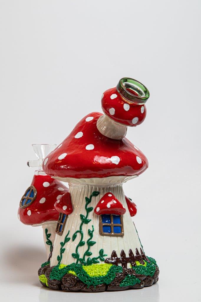7.5-inch Mushroom Water Pipe – a bong with a Mushroom House design for weed and dabs. For sale now, this unique piece features a 14MM male bowl piece for weed and a bent down stem, turning every hit into a magical and flav