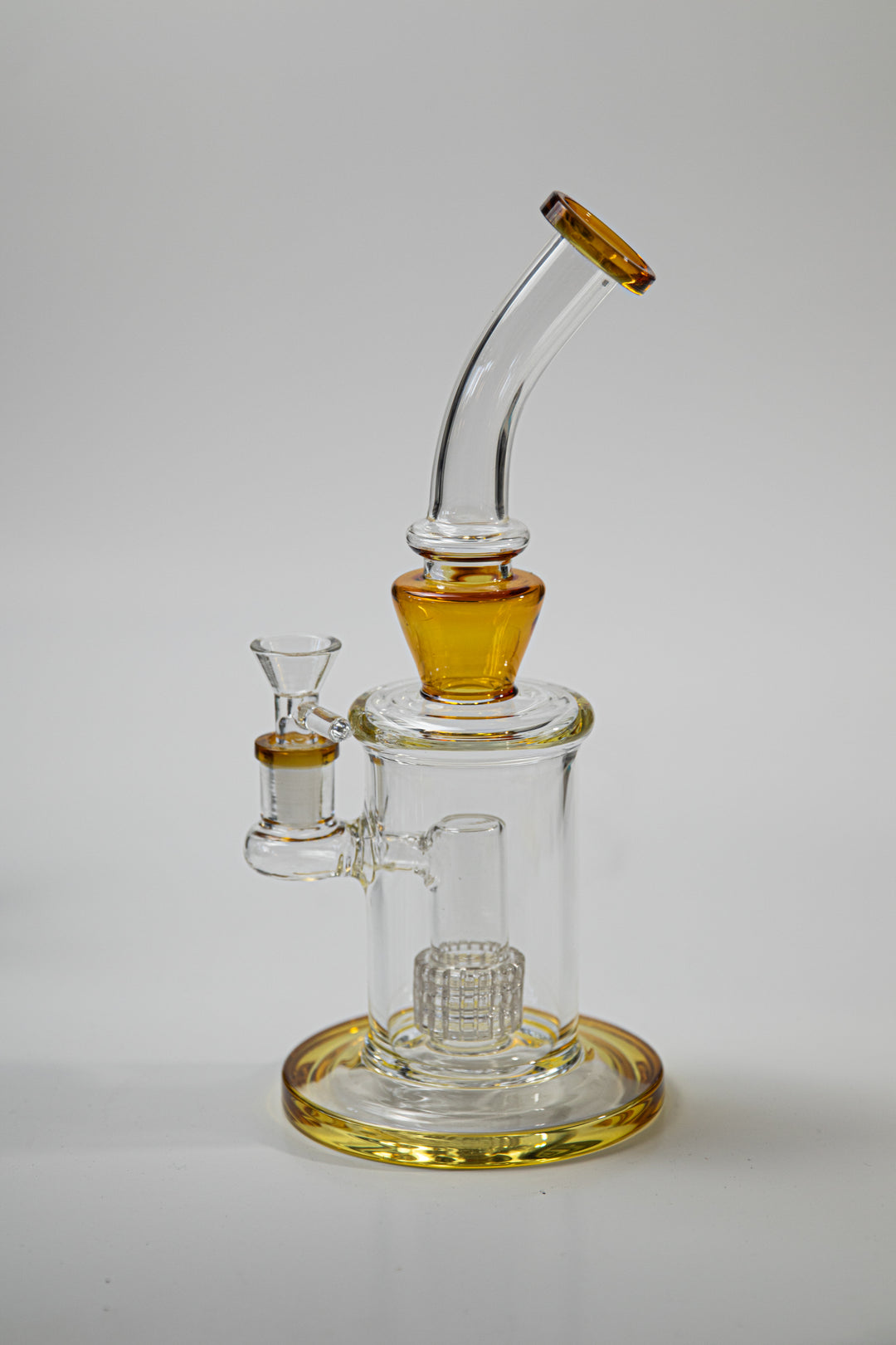 10 inch Matrix Water Pipe – a cutting-edge weed and dab companion in water bong style glass. Now available for sale, this unique piece features a 14MM male bowl, a bent down stem, and a bubbler perc. The integrated percolator ensures a smooth smoking experience, preventing water splashback, cooling the smoke down, and providing extra filtration. Colors orange 