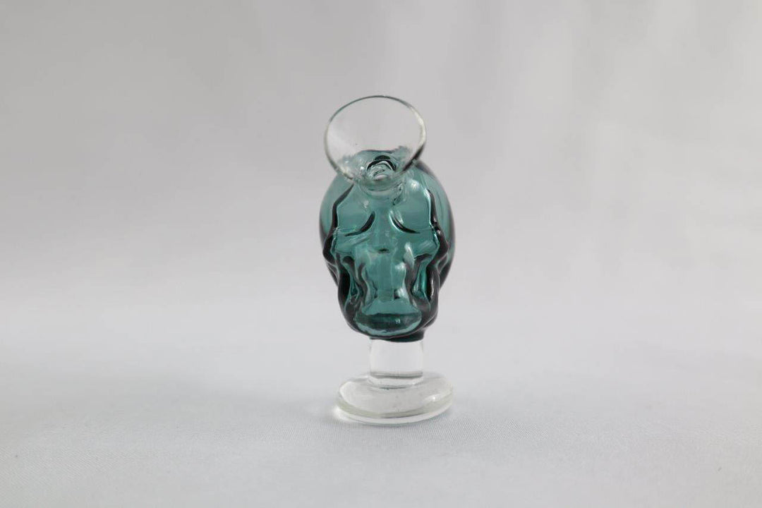 Teal/blue skull shape 2.75-inch Skull Blunt/Joint Bubbler – the ultimate stoner's choice for sale at an affordable price. Shaped like a pipe with a skull design, this piece is exclusively for only dry herb use. Grab yours and add a bold edge to your smoke routine.  Quality glass  