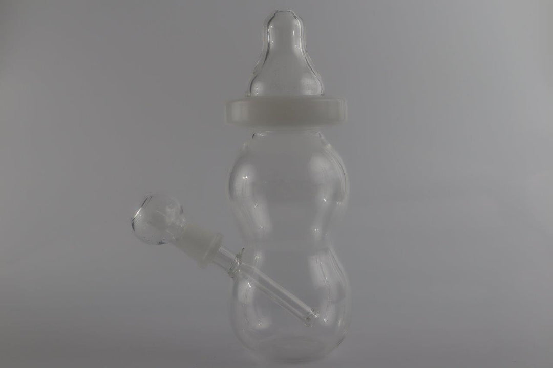 8-inch Baby Bottle Rig – the ultimate stoner's essential for a smooth and affordable water rig. For sale and designed in a playful baby bottle shape with a straight down stem, this piece comes complete with a nail, male-to-female experience .Can be use for  wax/weed , only Quality glass  