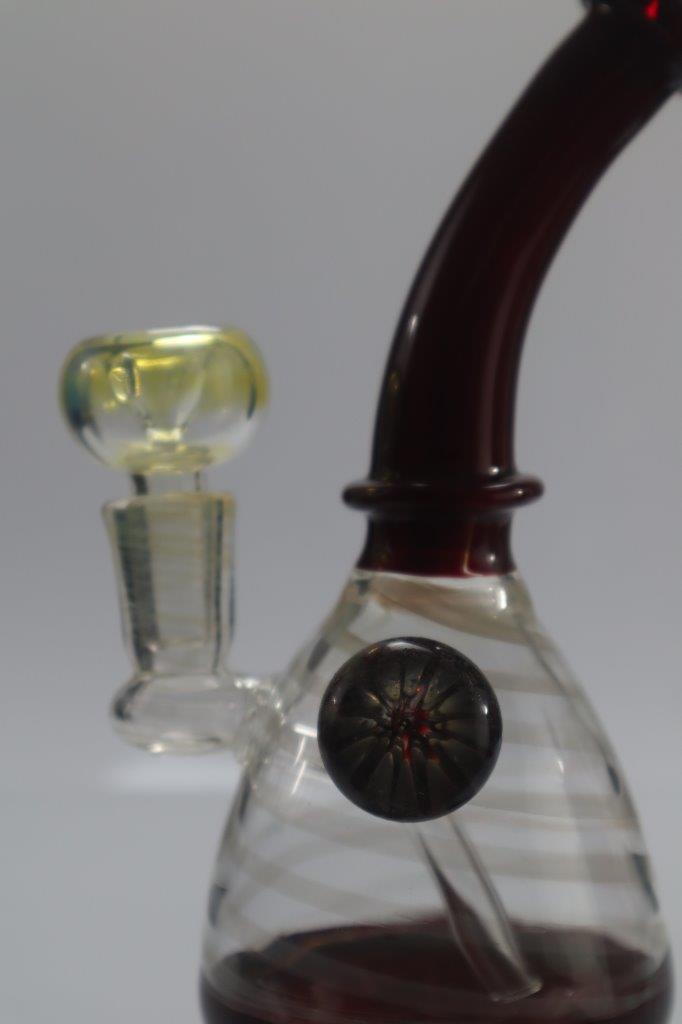 dark red curved stem bubbler water pipe with a clear weed bowl male piece with clear base red bottom