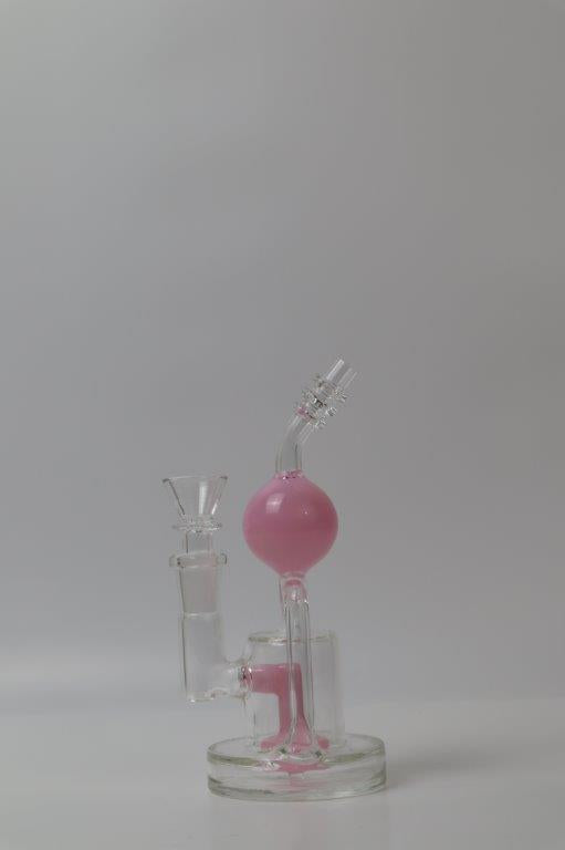 8-inch Sphere Water Pipe – a unique weed and dab companion in water bong style glass. Now for sale, this sphere-shaped beauty includes a 14MM female bowl and a tree perc bent down stem. The included percolator guarantees a smooth and rounded smoking experience, preventing water splashback and providing extra filtration for a refined hit every time . Color pink
