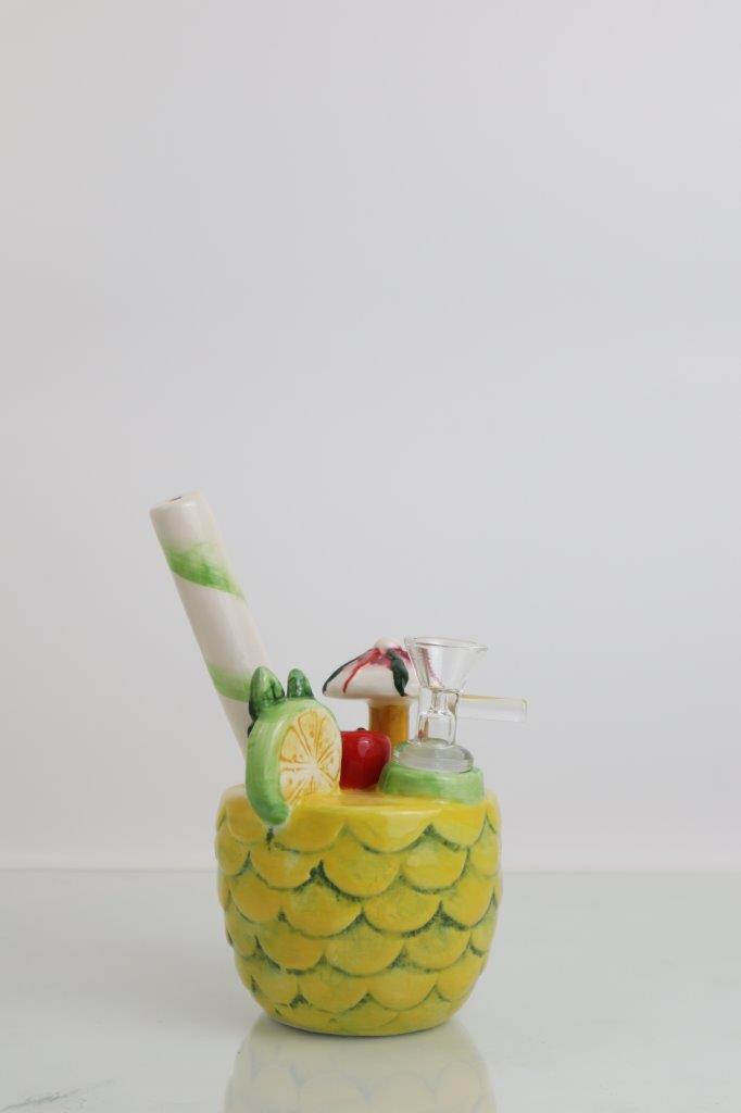 6.25 inch Pina Colada Pineapple Water Pipe – a flavorful twist for weed and dabs in water bong style glass. Now available for sale, this unique pineapple-shaped piece includes a 14MM male bowl,
